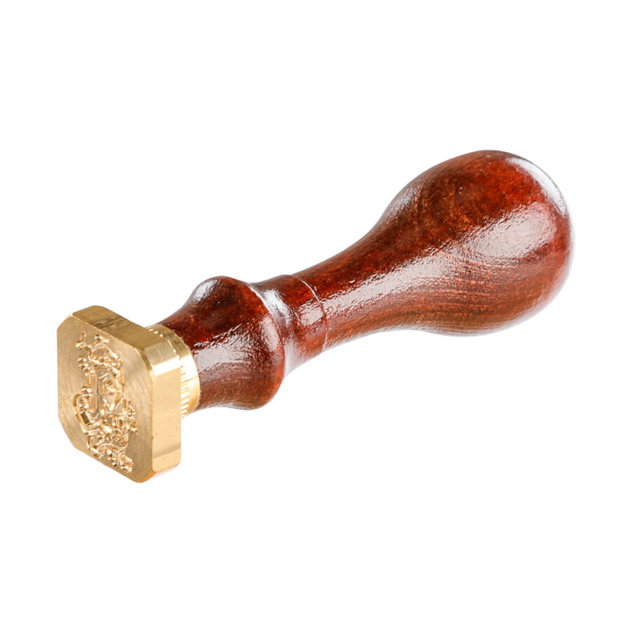 Square seal with varnished wooden handle, illuminated letter X