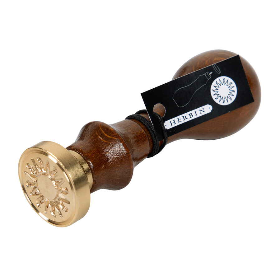 Round seal with varnished wooden handle, Sun symbol