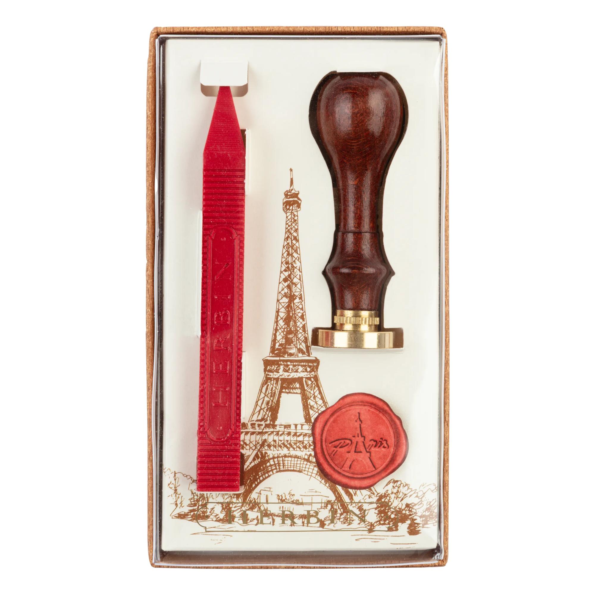 Un set Tour Eiffel comprenant 1 bâton de cire (rouge), un manche en bois et un sceau Tour Eiffel